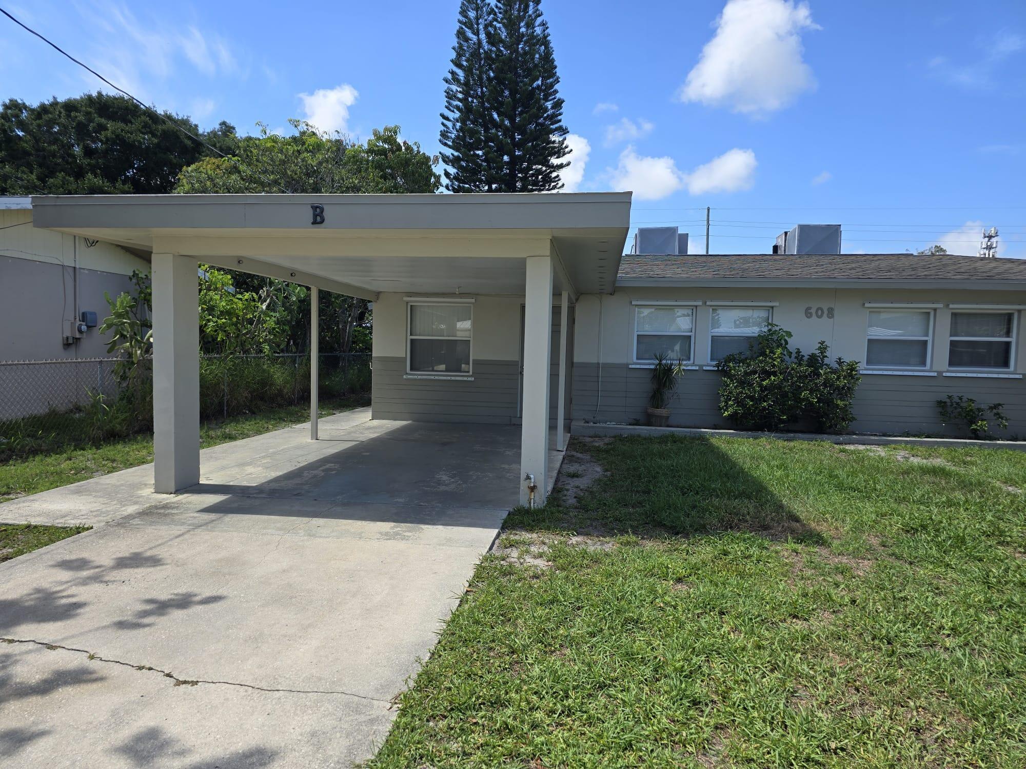 Beautiful open floor plan 1 bedroom 1 bathroom home, 2 car- car port. Open kitchen with wood cabinets and newly installed tile flooring throughout the home.