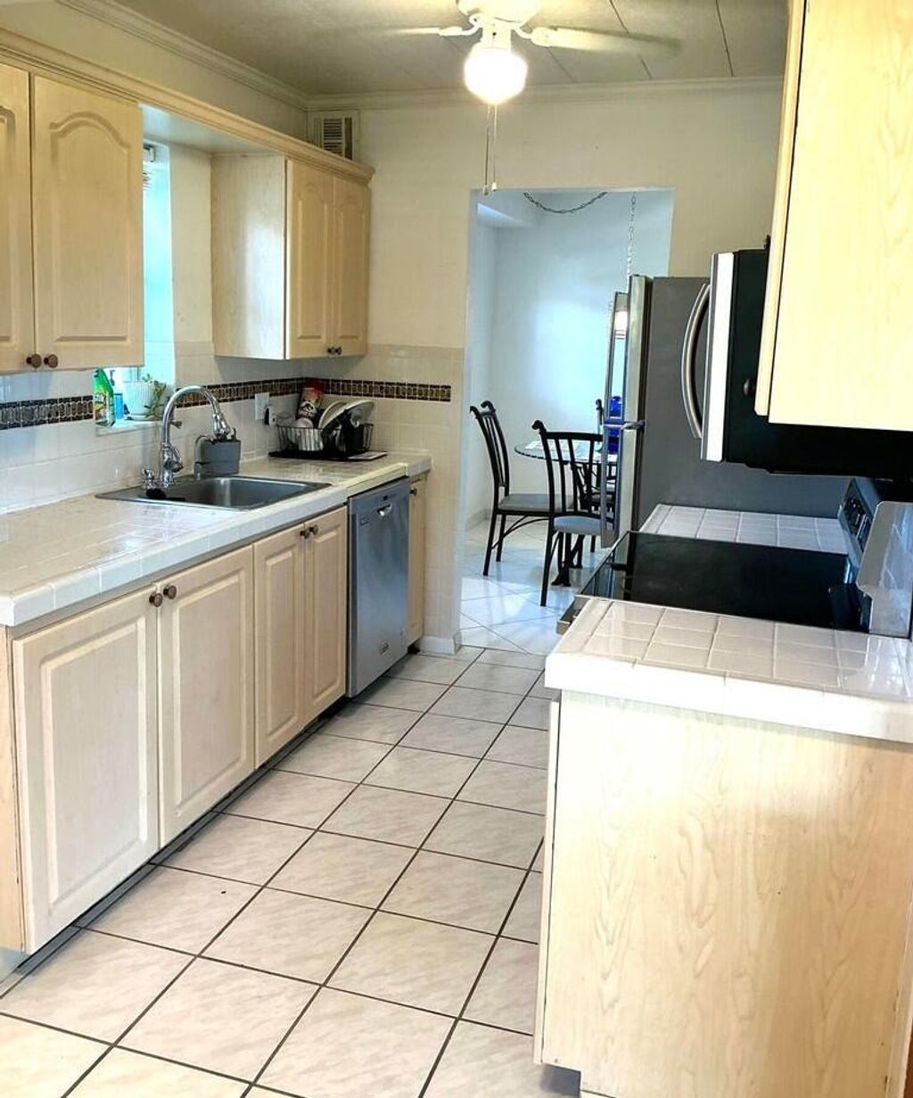 Photo of 8000 Lagos De Campo Boulevard #A-204, Tamarac, FL 33321 (MLS # R11159654)