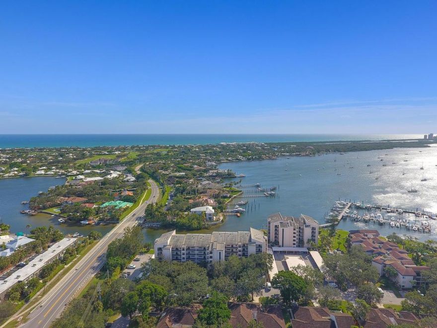 BEAUTIFULLY UPDATED TOP FLOOR CONDO WITH VAULATED CEILINGS AND STUNNING KITCHEN WITH BREAKFAST AREA. FULL GUEST SUITE WITH BATH AND FULLY LAUNDRY IN UNIT. MASTER HAS GORGEOUS VIEWS OF THE INTRACOASTAL DOWN TO SINGER ISLAND. 1 COVERED PARKING SPACE AND ACCESS TO TWO POOLS, TENNIS, PICKLE AND CLUBHOUSE. WALK TO STARBUCKS, PUBLIX AND SEVERAL AREA RESTAURANTS. POSSIBLE BOAT SLIPS TO RENT THATS HARD TO FIND