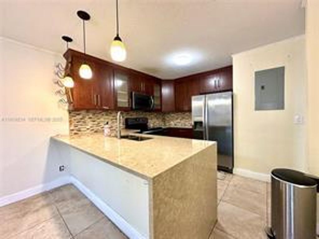 Photo of 3490 Deer Creek Palladian Circle, Deerfield Beach, FL 33442 (MLS # B26031605)