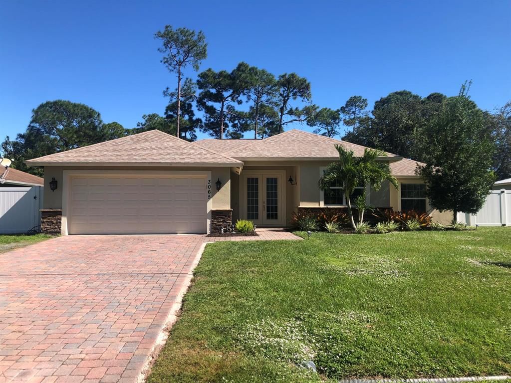 Photo of 3065 SW Collings Drive, Port Saint Lucie, FL 34953 (MLS # R10758086)