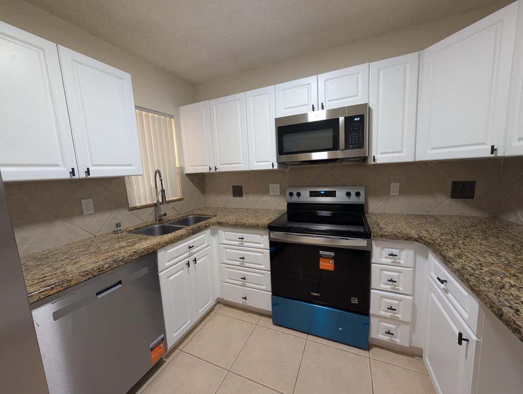 Photo of 3830 Coral Tree Circle, Coconut Creek, FL 33073 (MLS # B26058000)