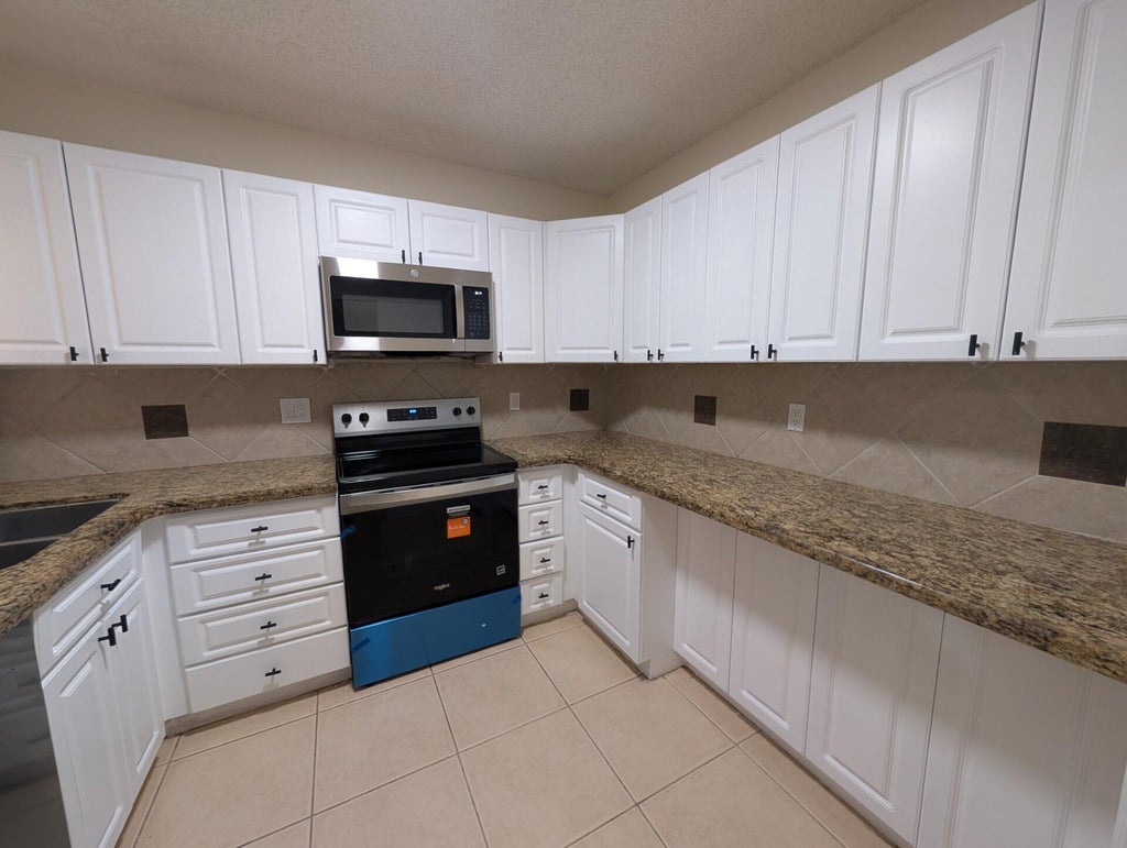 Photo of 3830 Coral Tree Circle, Coconut Creek, FL 33073 (MLS # B26058000)
