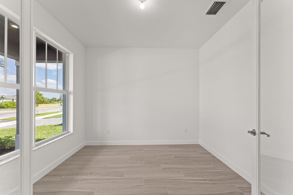 Photo of 13461 SW Bally Drive, Port Saint Lucie, FL 34987 (MLS # R11089987)