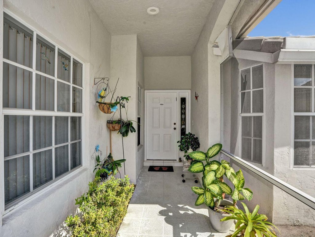 Photo of 7592 Ironbridge Circle, Delray Beach, FL 33446 (MLS # B26072889)