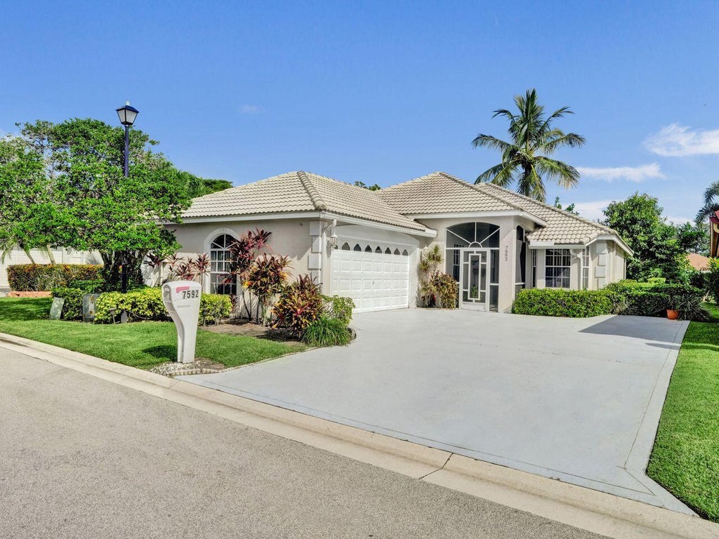 Photo of 7592 Ironbridge Circle, Delray Beach, FL 33446 (MLS # B26072889)