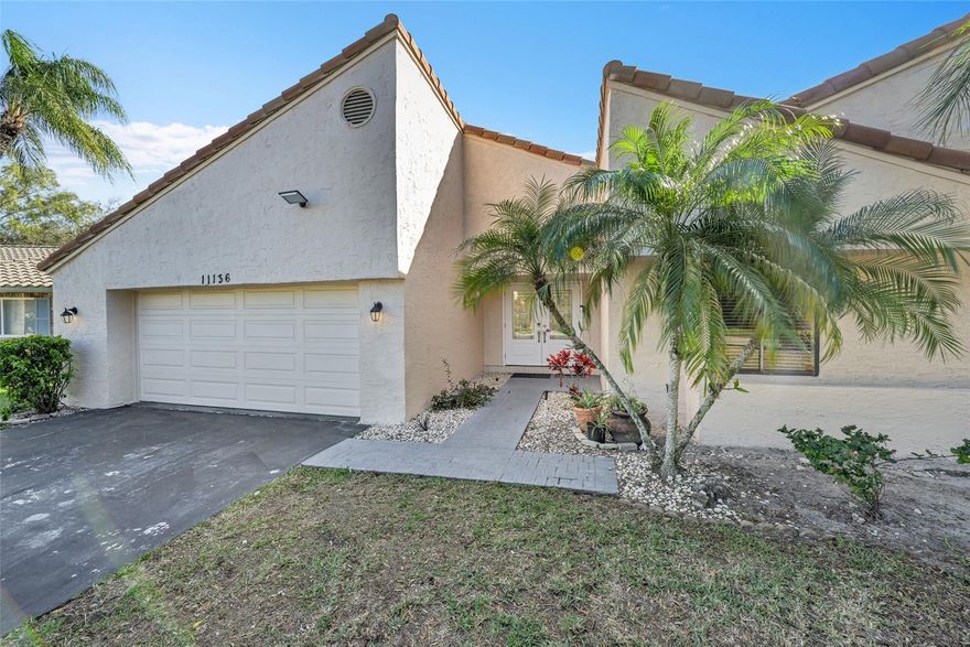 Welcome to this Luminous, Naturally Lit 4-bedroom, 2.5-bath home in Coral Springs. No HOA. Freshly painted Interior and Exterior. Highlights include vaulted ceilings, tile flooring throughout, spacious-open kitchen with dark wood cabinetry, large island, granite countertops, and stainless steel appliances. The home offers an updated spa-style bathroom, ample-sized bedrooms, hurricane-impact front doors, a 2-car garage, and an extended driveway. Enjoy expansive front and backyards with a patio and fruit trees, including avocado, mango, star fruit, and coconut. This home is angled to experience sunset and sunrise every day. Ideally located in a prime residential area with excellent schools, close to Sawgrass Trailhead park, shopping, and dining.