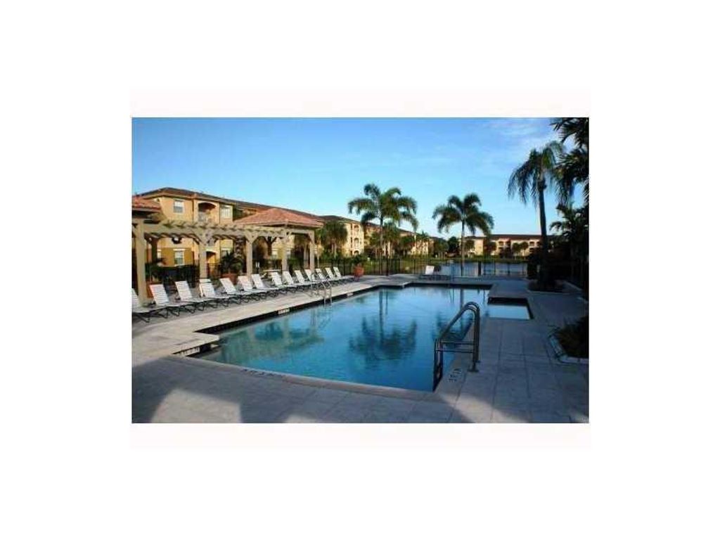 Photo of 9640 NW 2 Street #208, Pembroke Pines, FL 33024 (MLS # B26009934)