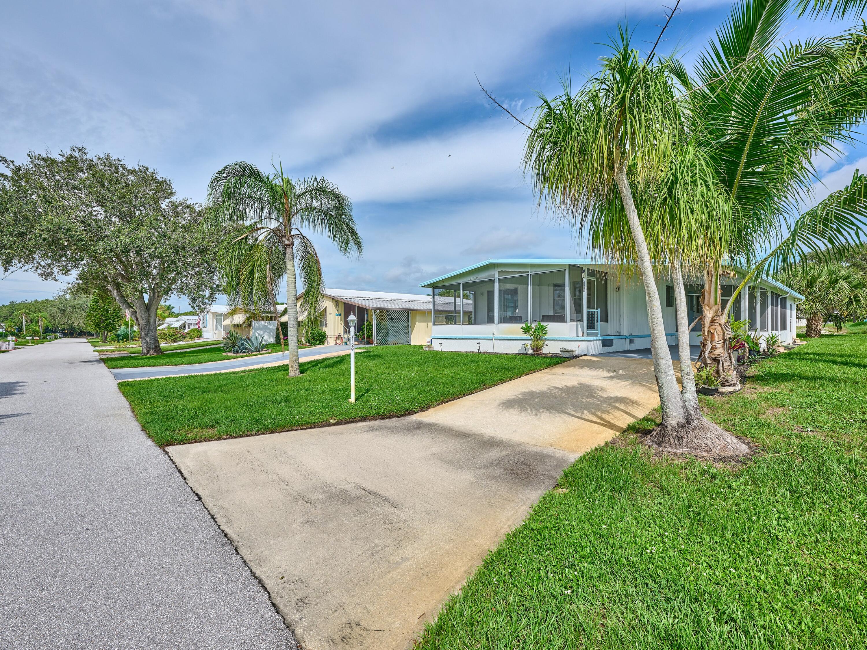 REMODELED 2 Bedrm/2 Bath Manufactured home in Ridgeway, all ages community in Hobe Sound. New Large Kitchen w wood, soft close cabinets & drawers, Quartz countertops & Stainless appliances. So much Storage!! Brand New 4 Ton A/C. Metal Roof recently coated/sealed. New Luxury vinyl flooring thruout. This home has so much room - Large, Sun Filled, LR w Dining area leading out to the Oasis of the front facing Lanai. In addition to that, there is a 2nd screened Lanai on the side of the home! The Master Bedrm is light & bright w updated Master Bath w new Vanity, chair height toilet & step in shower. The 2nd Bedrm suite has its own door into the 2nd full bath. Fresh paint in & out. New Sprinkler pump & timer for new sod. Large shed/workshop. YOU OWN THE LAND, ALL PETS WELCOME. Mins to Beach.