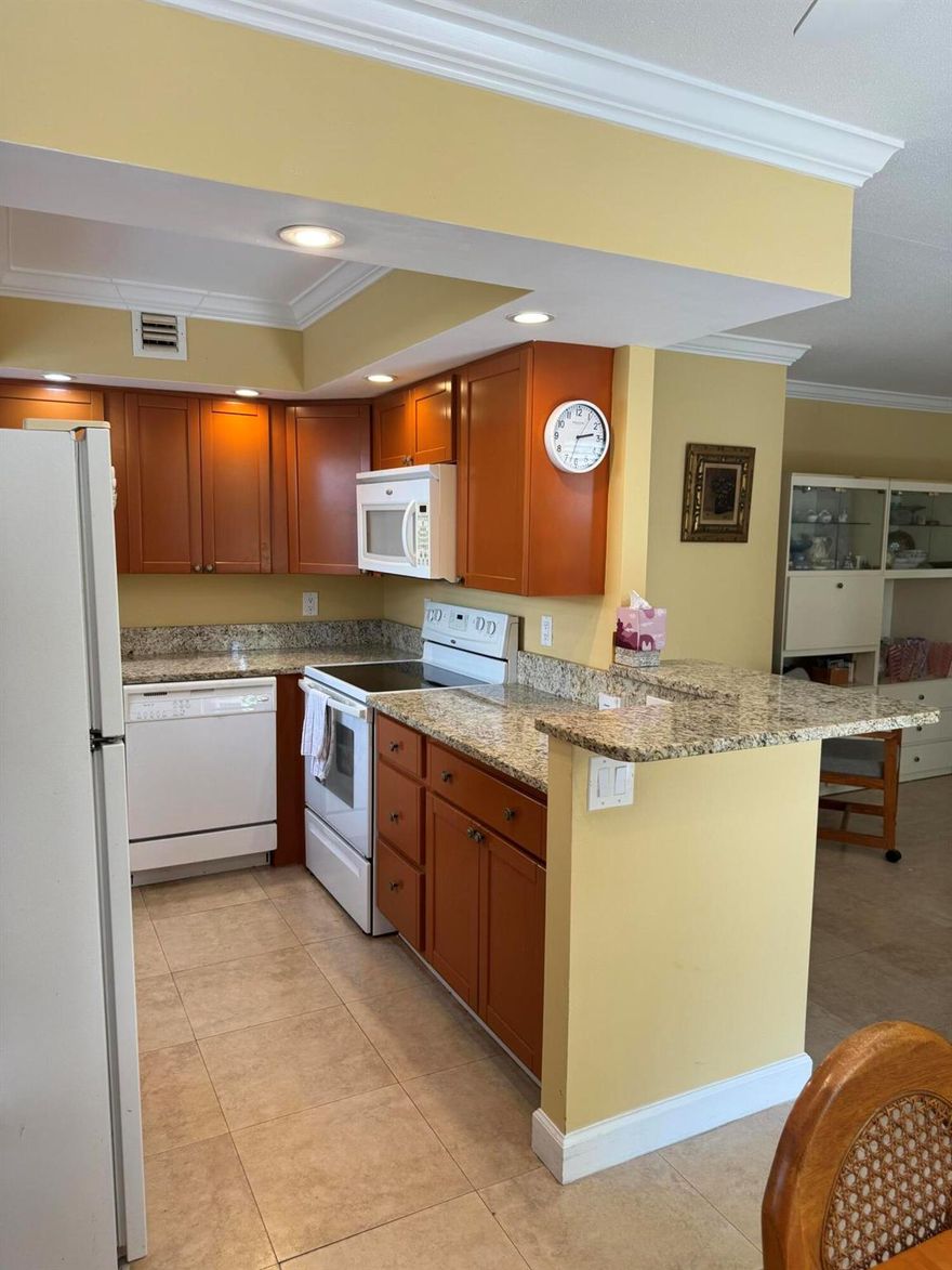 2/2 1st floor light & bright condo,with newer enclosed patio with a/c or slideopen the windows for fresh air.Tile through out condo,updated open kitchen with high hats, built in microwave.2 full baths,updated stepin shower.Ceiling fans in  bdrs & patio.Both bdrs have sliders leading out to to the patio for easy access. Secure Patio door leads right out to your parking space with easy paved walkway ramp with no stepdown.Condo is Located near the Monaco clubhouse entrance with cafe & pool or easy access to the Main Clubhouse with indoor/outdoor pools, two restaurants, theater, tennis/pickel ball free bus service,Golf course, clubs, gym ect.Condo is very close to Atlantic Ave, both major highways,house of worship, deli's 3 publix shopping centers, cvs,wallgreens approx 6 miles to the beach