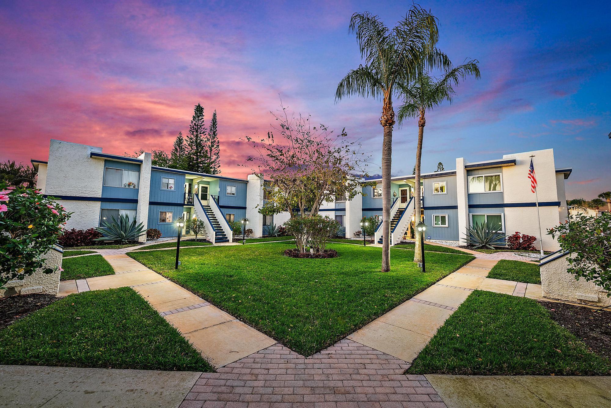 EXQUISITE 2-bedroom, 2-bathroom condo in the highly sought-after 55+ community of Beacon 21 Condo C in Jensen Beach! This spacious second-floor unit boasts 1,272 square feet of living space, an enclosed glassed-in porch, a beautifully updated interior with tile flooring throughout, and a 2024 roof, a 2022 AC, and a 2022 water heater.Step inside to find a charming kitchen immediately to your right, featuring modern appliances less than two years old, ample cabinetry, and a bright window with serene outdoor views. Beyond the kitchen, the open-concept dining area flows seamlessly into the expansive living room, creating a perfect space for entertaining. Natural light floods the space, leading you to the enclosed patio, where large windows offer a tranquil setting to relax and