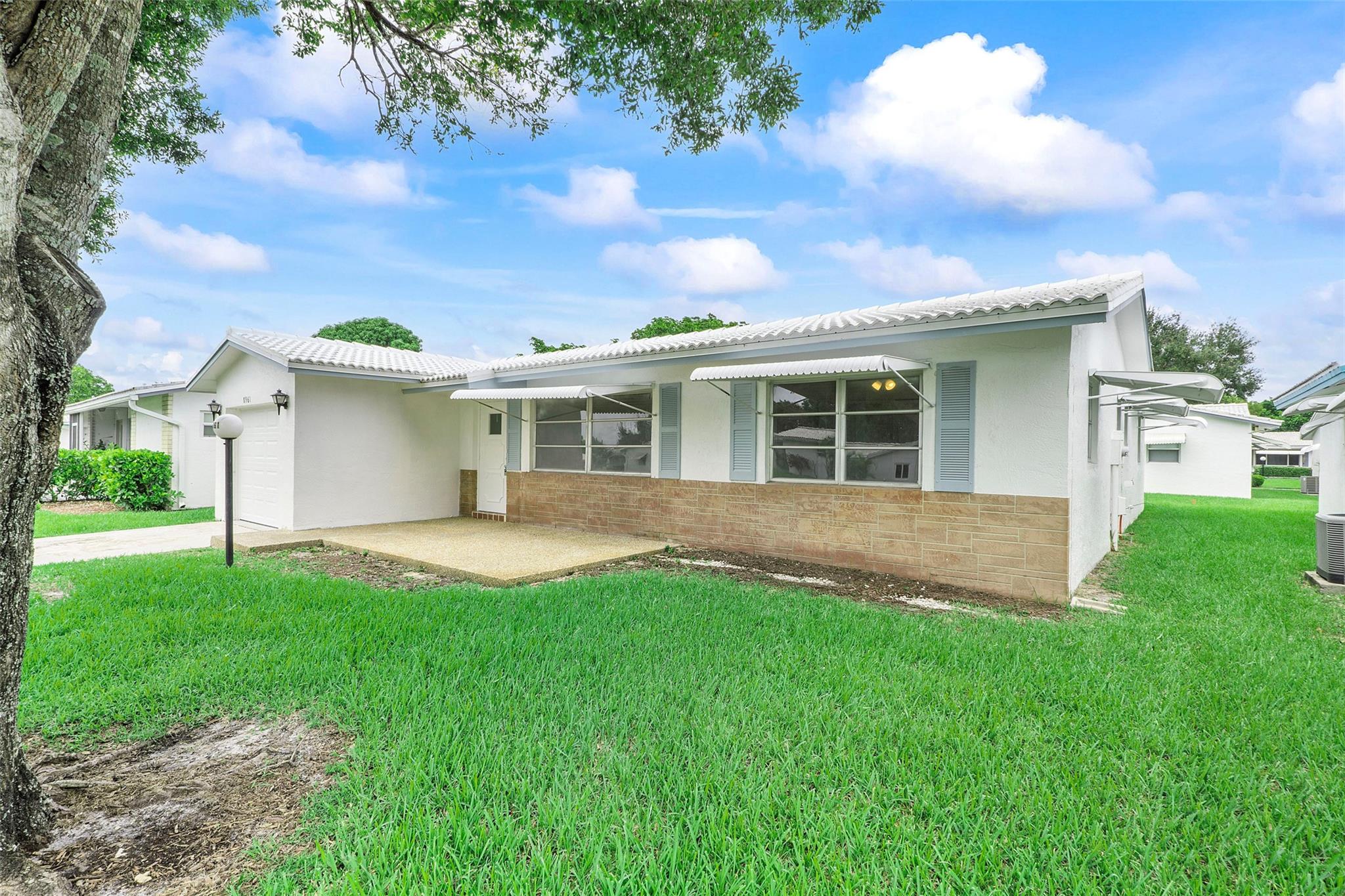 2024 ROOF , 2024 AC , 2024 Impact Garage door, New Kitchen ,New Bathrooms , New Stainless steel appliances, New porcelain tiled flooring and many more. Completely remodelled 2 Bed /2 Bath w/garage in a 55+ Community. The house has lot of open space and a large Florida room for entertainment. The garage has Epoxy flooring finish. Assoc. Fee Includes: Fiber Optic HDTV & Internet, Free community bus at your door, Lawn Service, Exterior painting, Huge Clubhouse, 2 Pools Tennis Courts, Pool Tables, Ping Pong, Card rooms, Professional Shows, Fitness Center & more! Buyer to be pre-approved by seller's prefered lender. Easy to show , vacant on Lock Box.