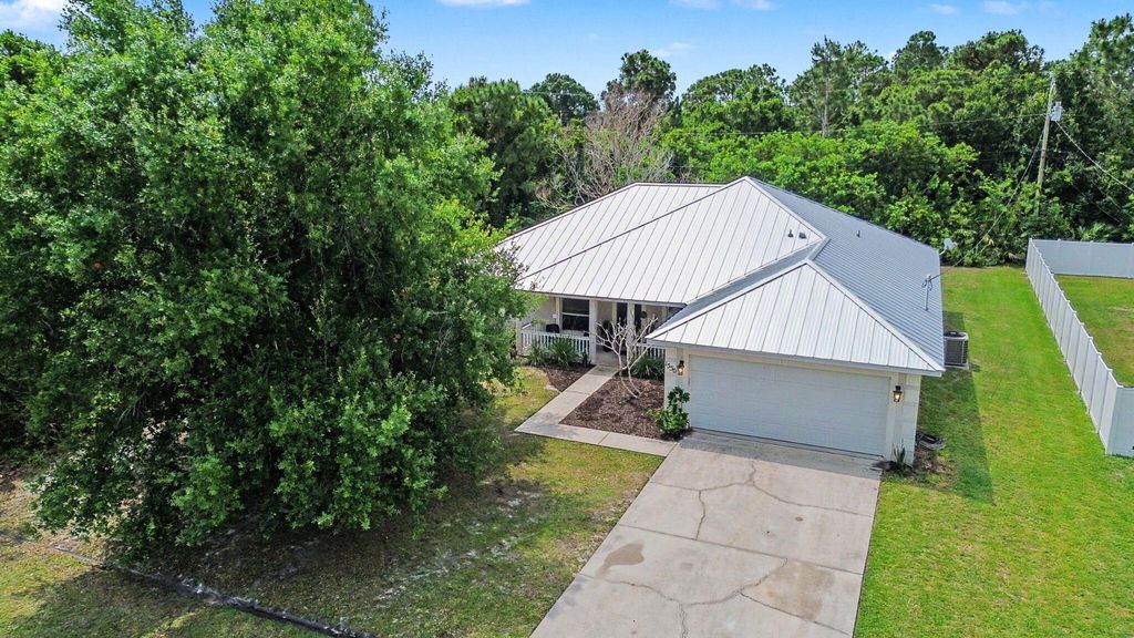 Photo of 1550 SW Kosnar Avenue, Port Saint Lucie, FL 34953 (MLS # B26027775)
