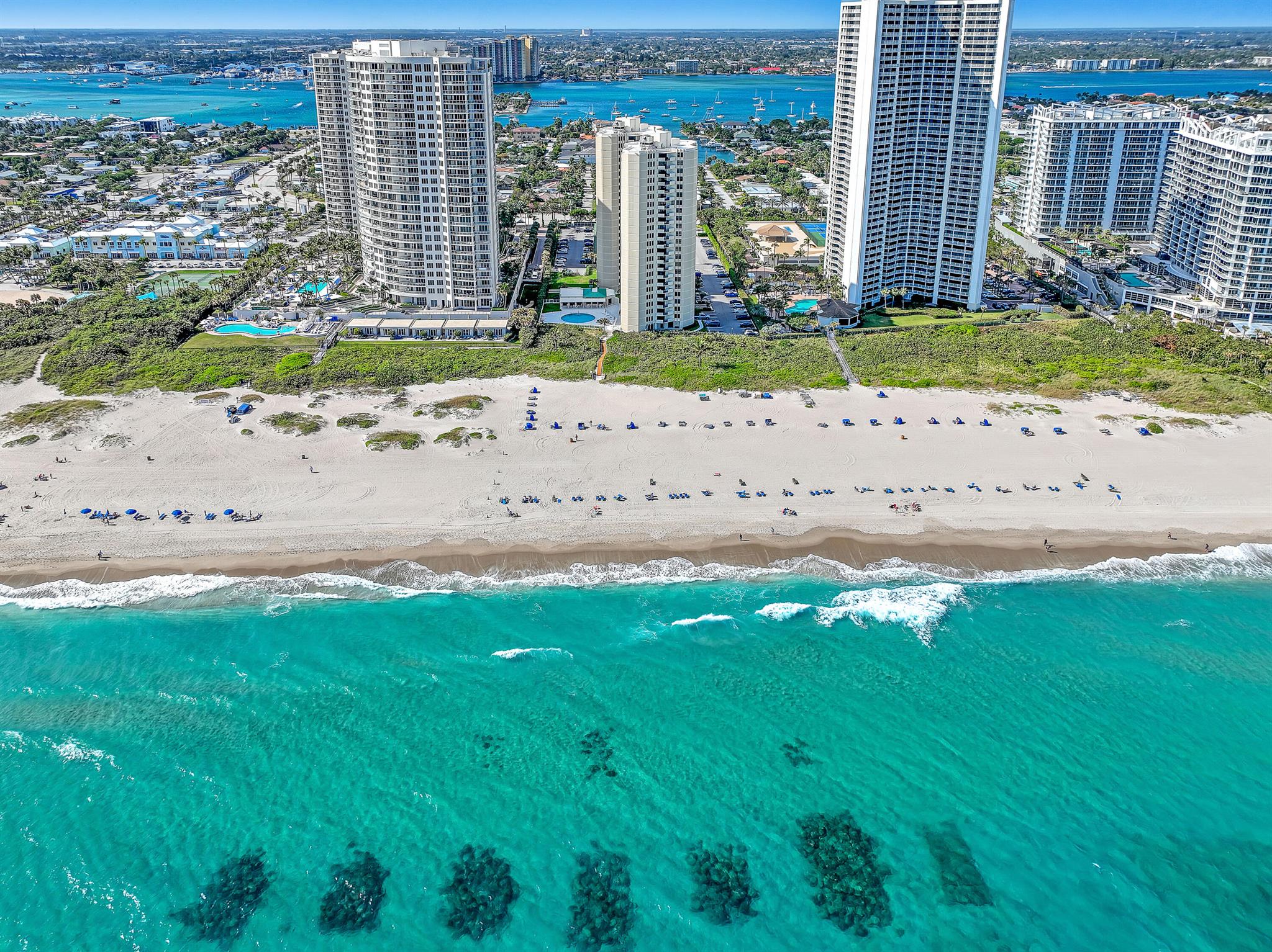 Welcome to Phoenix Towers, an iconic oceanfront community on the pristine shores of Singer Island. This spacious 2-bedroom, 2-bathroom condo is perfect relaxing getaway. It offers breathtaking ocean views and a prime location just a block from the Ocean Walk Mall and a short drive to Palm Beach Gardens. Relax on your private balcony with its stunning ocean view. Enjoy the sparkling pool, stay active on the tennis court, or work out in the fitness center. Oceanfront on Singer Island's pristine beaches, you'll love the opportunities for swimming, sunbathing, and seaside walks. Dive and snorkel Blue Heron Bridge, One of the most renowned dive sites in the world.