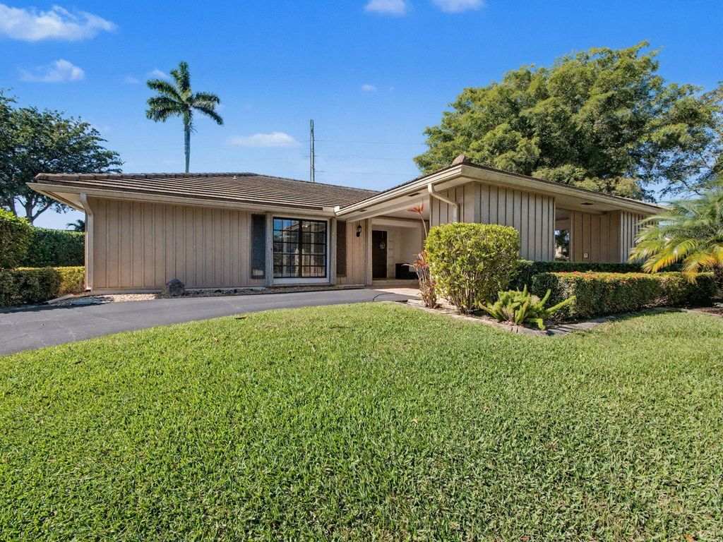 Photo of 720 Muirfield Circle, Atlantis, FL 33462 (MLS # R11159383)