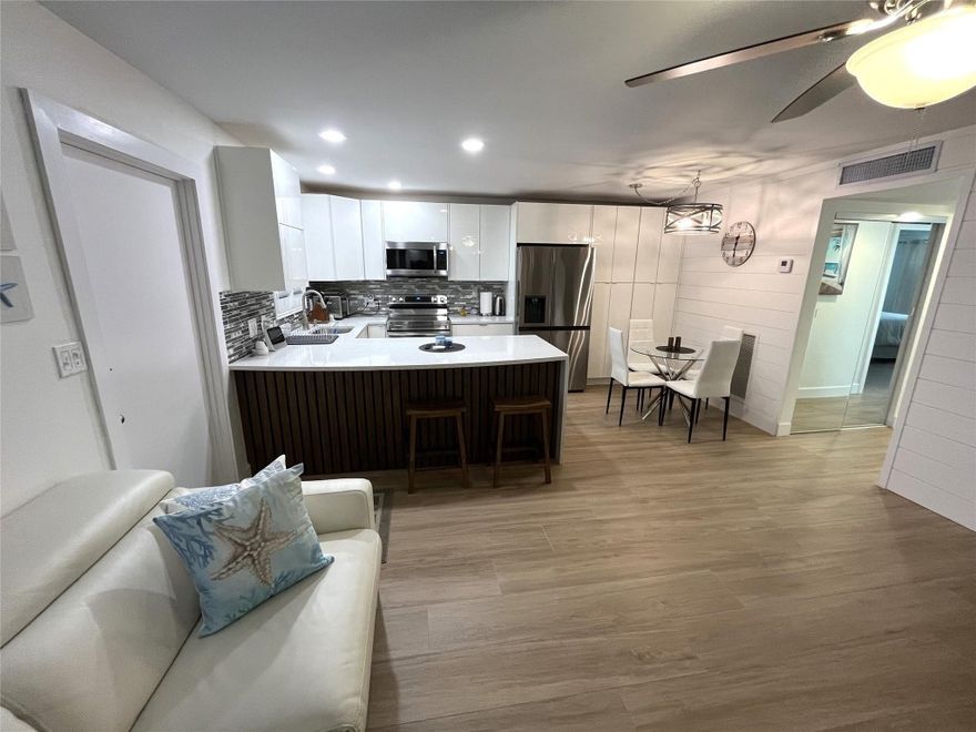 You Must see this beautiful professionally renovated Pool side unit with water view in Pompano Beach, FL. Renovation cost north of $80k. Dock space available on wait list. Exterior restoration near completion. Low electric bill at $50/mo, low condo fees at $568.81. This unit has first class materials including Porcelain and Marble Tile on floors and bathroom walls, custom wood trim and shiplap wall and ceiling in 2nd BR. Custom cabinetry, plenty of storage. Walk outside to your balcony and you are steps away from the pool deck and canal view. 2 minutes to the Intracoastal Waterway, 15 minute from Hillsboro Inlet and 8 minute walk to the beaches. Pets are allowed, leasing is allowed after 1 year of ownership, 1 parking space with guest parking available for a 2nd vehicle. The unit is fully furnished with a murphy bed and brand new updated electric panel and new on demand space saving water heater. The upgrades will ensure a seamless and easy property insurance approval. Don't waste a year of time with a renovation project, this unit is ready to move in.