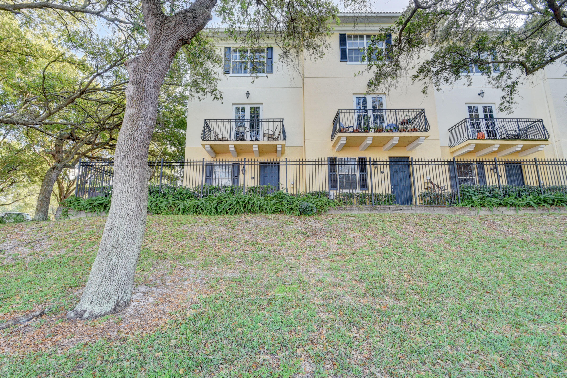 Remarks:BEST LOCATION IN THE COURTYARDS! LIGHT AND BRIGHT 3/3.5/2 END UNIT OVERLOOKING A WIDE CANAL. ENJOY A PRIVATE TERRACE AMONGST THE TREE TOPS WITH SERENE WATER VIEWS. ENJOY A WELL MAINTAINED OVER 1700 SQ. FT. TOWN HOME THAT INCLUDES COMPLETE WINDOW TREATMENTS, ATTRACTIVE LIGHTS & FANS, LOTS OF CLOSETS, A 2 CAR GARAGE W/AUTO OPENER, HURRICANE IMPACT GLASS AND IS STEPS FROM THE POOL. THIS 3 STORY TOWN HOME HAS A THIRD BEDROOM, OFFICE OR DEN ON THE 1ST FLOOR WITH ATTACHED BATH. THE 2ND FLOOR HAS A SPACIOUS LIVING/DINING WITH 9' CEILINGS, A POWDER ROOM, UPGRADED KITCHEN WITH 42'' MAPLE CABINETS, GRANITE COUNTERS AND BRAZILIAN CHERRY WOOD FLOORS. REAL HARDWOOD FLOORS. THE 3RD FLOOR HAS TWO BEDROOMS, BOTH WITH ATTACHED BATHS. THE MASTER BATH HAS DOUBLE SINKS, A GARDEN TUB AND SEPARATE SHOWE