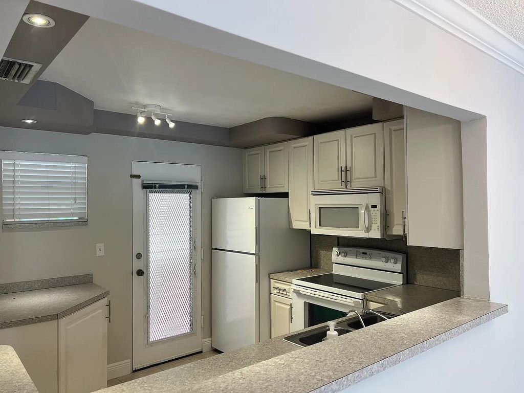 Photo of 403 NW 68th Ave #202, Plantation, FL 33317 (MLS # F10541262)