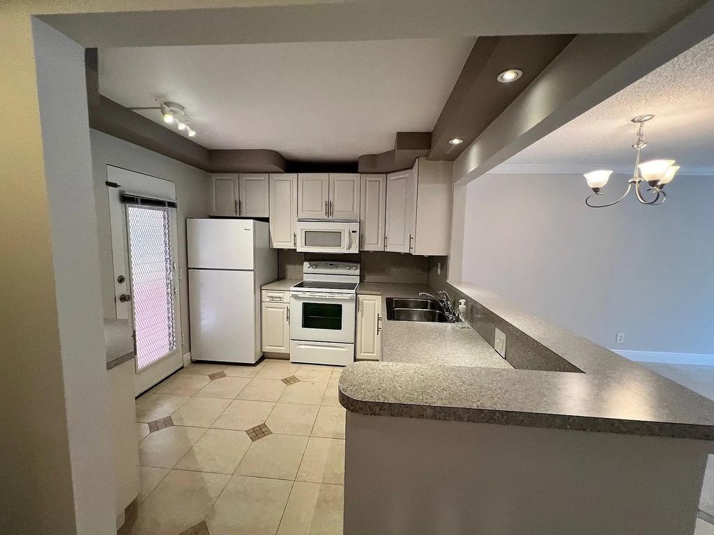 Photo of 403 NW 68th Ave #202, Plantation, FL 33317 (MLS # F10541262)