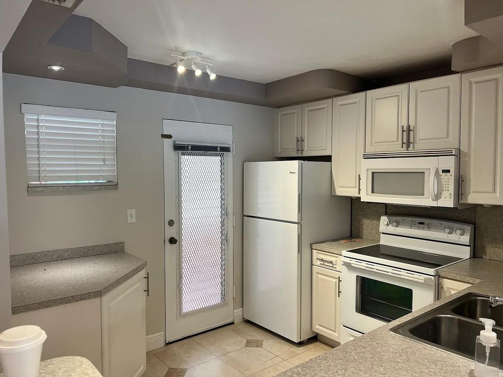 Photo of 403 NW 68th Ave #202, Plantation, FL 33317 (MLS # F10541262)