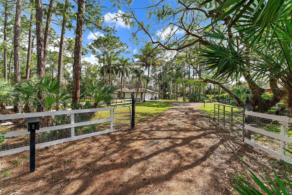 Photo of 16528 Temple Boulevard, Loxahatchee, FL 33470 (MLS # R10957562)