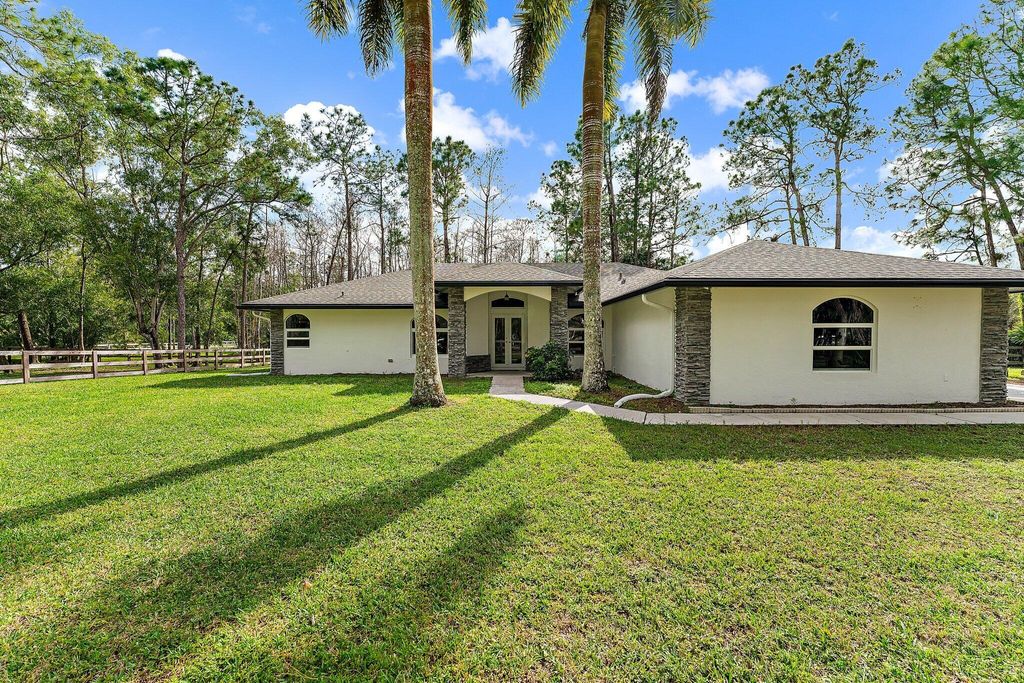 Photo of 16528 Temple Boulevard, Loxahatchee, FL 33470 (MLS # R10957562)