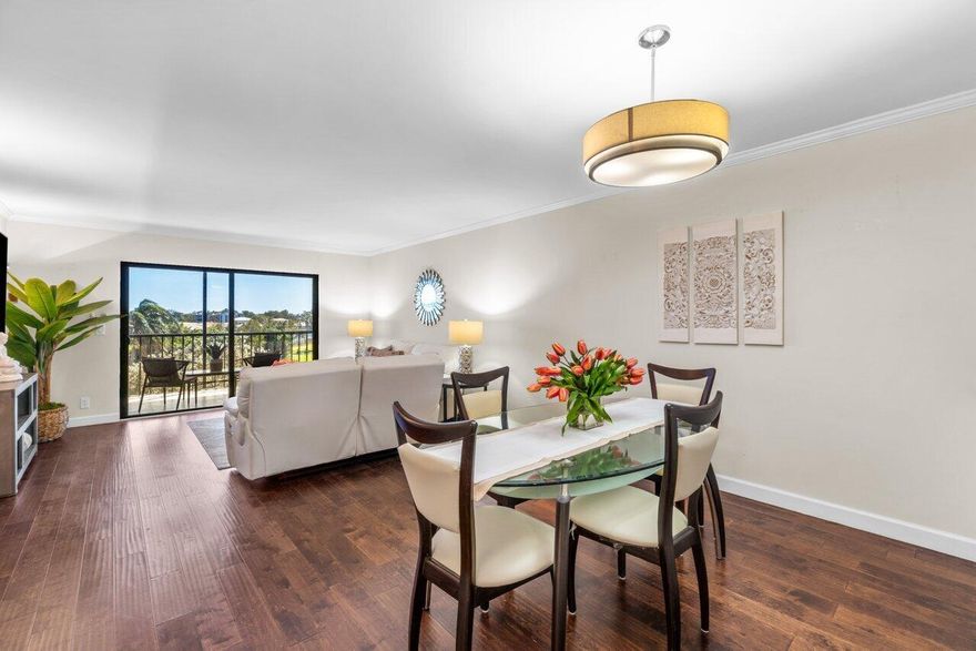 THIS COMPLETELY REMODELED CONDO FEATURES BEAUTIFUL ENGINEERED WOOD FLOORING THROUGHOUT & FULL BRAND NEW HURRICANE IMPACT WINDOWS!   THE KITCHEN HAS GRANITE COUNTER TOPS, WHITE CABINETS & S/S APPLIANCES!  
THE PRIMARY BEDROOM IS VERY SPACIOUS INCLUDING A SITTING AREA & TWO LARGE WALK-IN CLOSETS.  THE PRIMARY BATHROOM HAS BEEN REMODELED WITH CLEAN LINE FINISHES. RELAX IN THE FLORIDA TO ENJOY THE GORGEOUS LAKE VIEWS IN THE COOL A/C OR OPEN THE GLASS DOORS TO ALLOW THE COOL BREEZES TO BLOW THROUGH...BEST OF BOTH WORLDS. THE CLUBHOUSE HAS JUST BEEN ELEGANTLY REMODELED w/ A FULL 600 SEAT THEATER FOR MOVIES & SHOWS, FITNESS CENTER, CARD ROOMS & BILLIARDS, CLUBS & ORGANIZATIONS, TENNIS & PICKLEBALL...WONDERFUL WALKING TRAIL THAT MEANDERS AROUND THE LAKES & TREES. 5 SATELLITE POOLS & 2 GATES