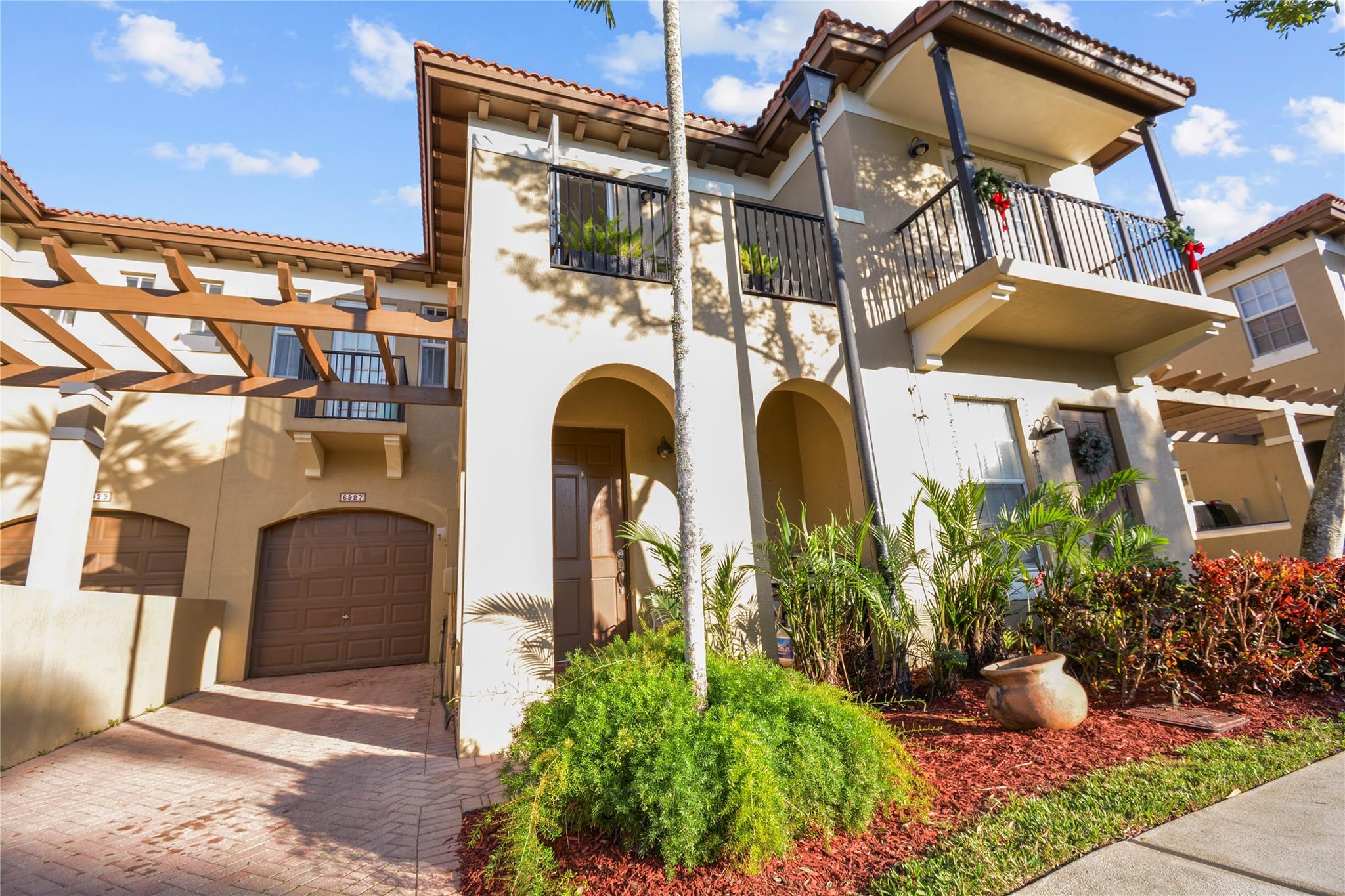 This charming townhouse in the gated community offers 3BED, 2.5BATH, a spacious master suite w/ a private balcony, impact-resistant windows, a brand-new water heater, & a private one-car garage. One of the few townhouses in here w/ a large covered front patio for outdoor relaxation and a fully shade backyard w/ tropical plants and trees for added privacy that does not face the busy Hillsboro Blvd, providing a peaceful setting, just 100 yards from a tranquil lake. An incredible community lifestyle w/ a private backyard, a family playground, community pool and clubhouse & lake views. Priced to sell in this rare-to find, low HOA community. Close to dining, six miles from beach, and minutes from 95, turnpike and sawgrass expressway. Seller offering incredible seller credits for closing!