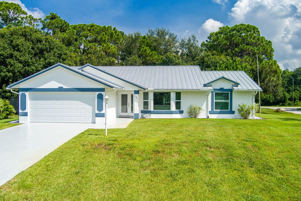 Photo of 1901 SW Yellowtail Avenue, Port Saint Lucie, FL 34953 (MLS # B26069755)