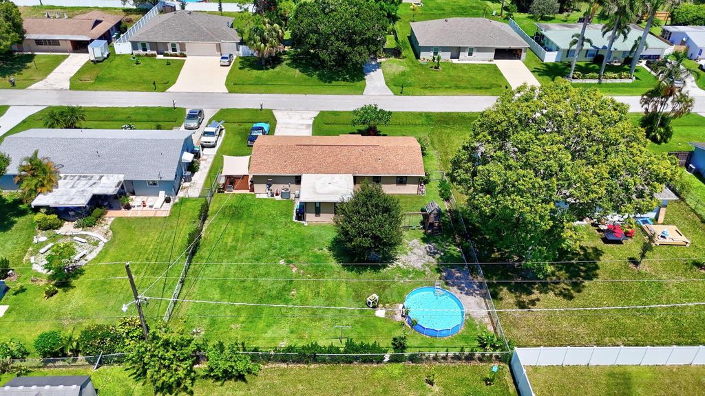 Photo of 536 SW Buswell Avenue, Port Saint Lucie, FL 34983 (MLS # R11117692)