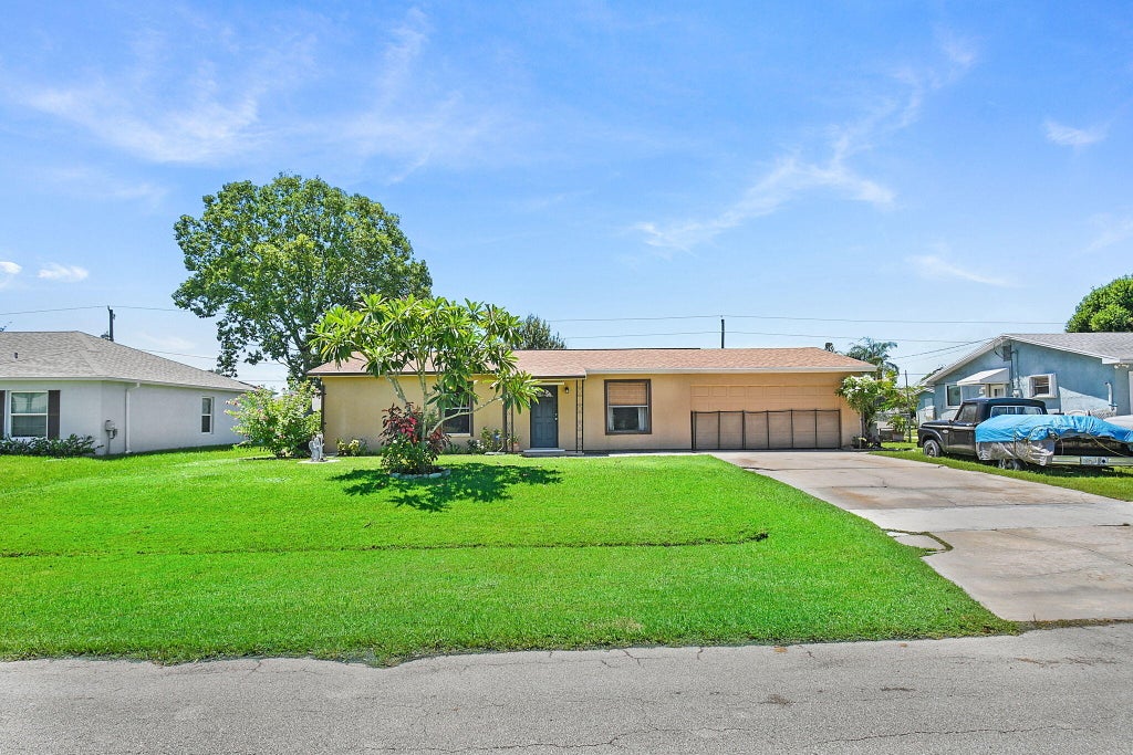 Photo of 536 SW Buswell Avenue, Port Saint Lucie, FL 34983 (MLS # R11117692)