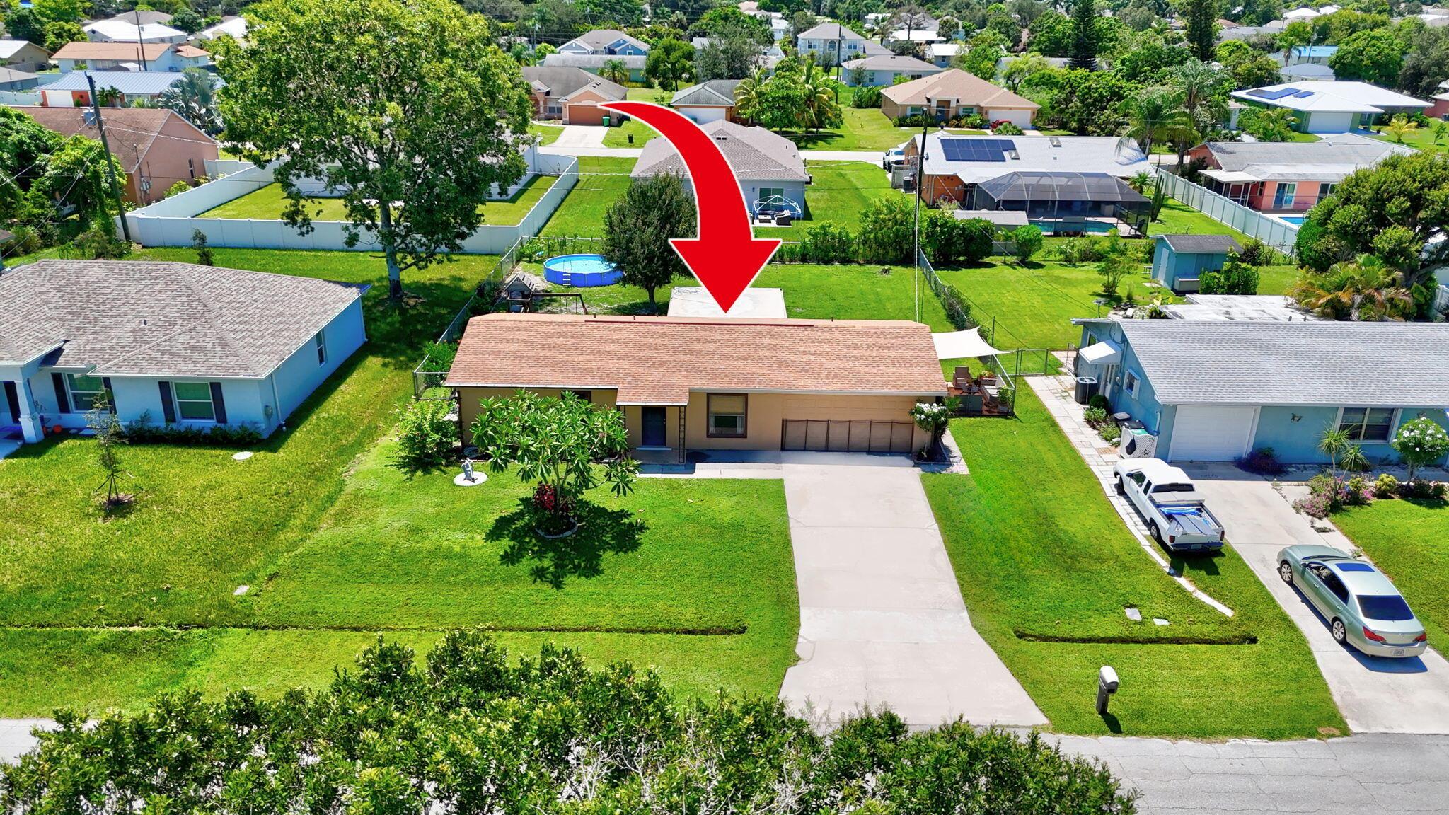 We have got a good one for you today! In a market where there are not many options under $300K, this home is waiting for the next family to make it their own and create new memories. Located in the Bayshore area of Port St Lucie, this 2-bedroom, 2-bathroom home has a bonus room that can be used as a den, third bedroom, toy room or man cave/mom-cave. The possibilities are endless. No insurability concerns here, as the roof was replaced in 2021 and there are complete panel storm shutters. With Northern front exposure, you'll have the benefit of a cooler home instead of the sun beating down on your front or back yard. For storage, there is a utility room and both bedrooms have walk-in closets. The back yard is fenced and even though it's standard size, feels quite big.