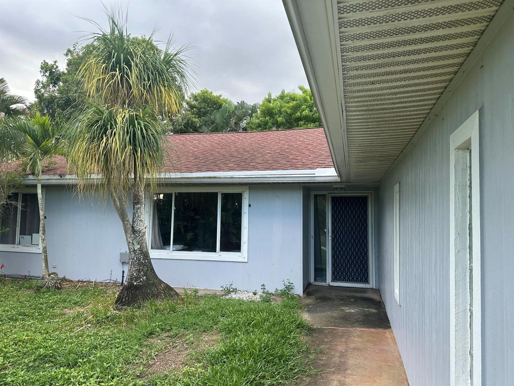 Photo of 8812 SE Sandridge Avenue, Hobe Sound, FL 33455 (MLS # R11145321)