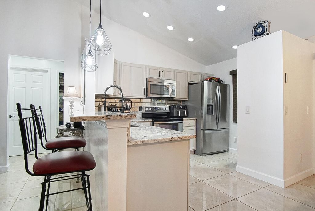 Photo of 1682 SW Lofgren Avenue, Port Saint Lucie, FL 34953 (MLS # R11138846)