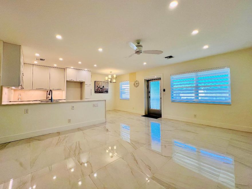 SPECTACULAR IN 55+ CENTURY VILLAGE! Gorgeous & Completely Updated Water View Two Bedroom /Two Full Bath Located In The Convenient Bedford Section. Updated & Open Kitchen, Designed To Maximize Space, Features  White Cabinets, Expanse of Solid Surface Counters, Large Island, and Two Sinks. Two Updated Full Baths. Water View Bedroom Suite W/ Ensuite Bath. Long Enclosed Lanai W/ Floor to Ceiling Impact Windows. Gleaming Tile Flooring Flows Throughout. Popcorn Removed From Ceilings. High Hat Lights In Living Area. Custom Designer Window Treatments. Impact Windows Front & Back. Fantastic Location Close to the Haverhill Entrance, Main Clubhouse, and the Somerset Pool! Century Village Is A Vibrant 55+ Community Centrally Located In Beautiful Palm Beach County, Florida! Enjoy Resort Style... Amenities and An Active 55+ Lifestyle With shows, movies, clubs, pools, security, and transportation service. The Clubhouse features a theater, indoor pool, card room, community/party room, billiard room, shuffleboard, tennis, pickleball, bocce, and two outdoor pools, Numerous heated outdoor pools throughout the community. Separate fitness center with gym and outdoor heated pool & resistance pool. Two guarded gates and 24-hour roving security patrol.