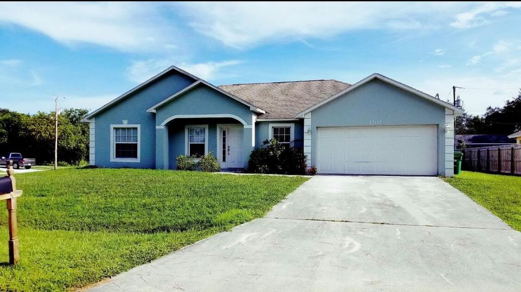 Photo of 1202 SW Albenga Avenue, Port Saint Lucie, FL 34953 (MLS # R11001682)