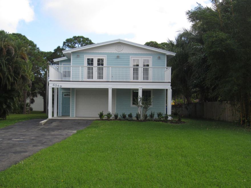 This newly remodeled Coastal style home boasts brand new metal roof, impact windows and doors. The exterior is fiber cement Hardie plank.   Second floor has a large deck off living room and dining area. First floor has large family room with slider to back yard and patio with pavers. Kitchen has new stainless steel appliances, new cabinets and granite counter tops. New vinyl plank flooring in common areas and new carpets in all bedrooms. The  air conditioner is a Lennox unit from 2017. Both bathrooms have been remodeled with a tub in main bath and walk in shower in master bath. Plenty of space in this garage for golf cart , workshop or some of your toys.