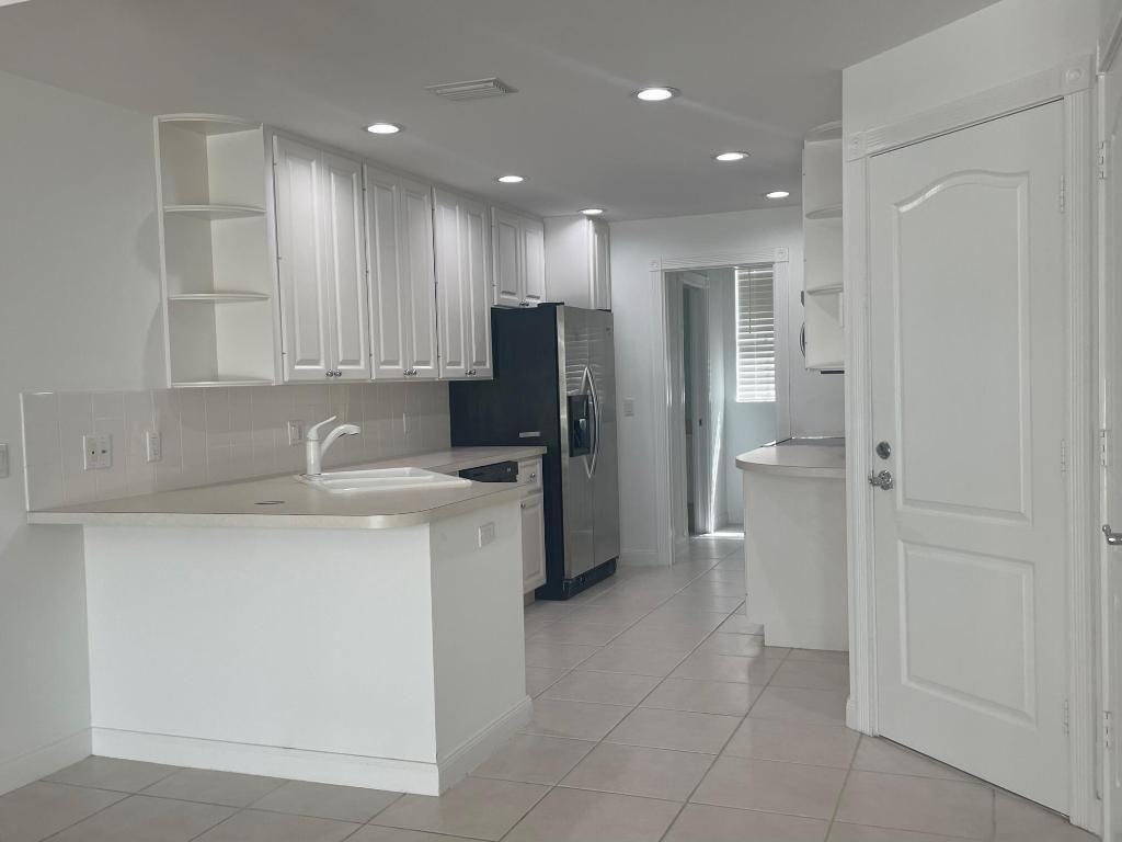 Photo of 217 Fortuna Drive, Palm Beach Gardens, FL 33410 (MLS # R11021338)