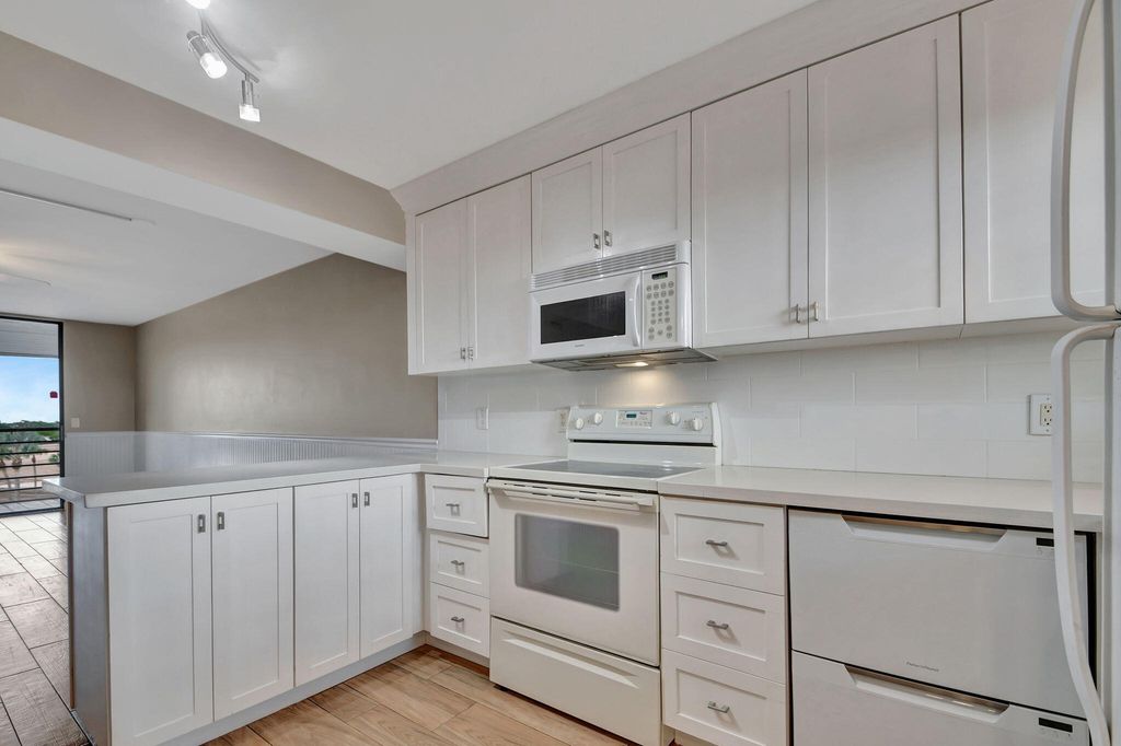 Photo of 4640 W Lucerne Lakes Blvd Blvd W #502, Lake Worth, FL 33467 (MLS # B26021857)