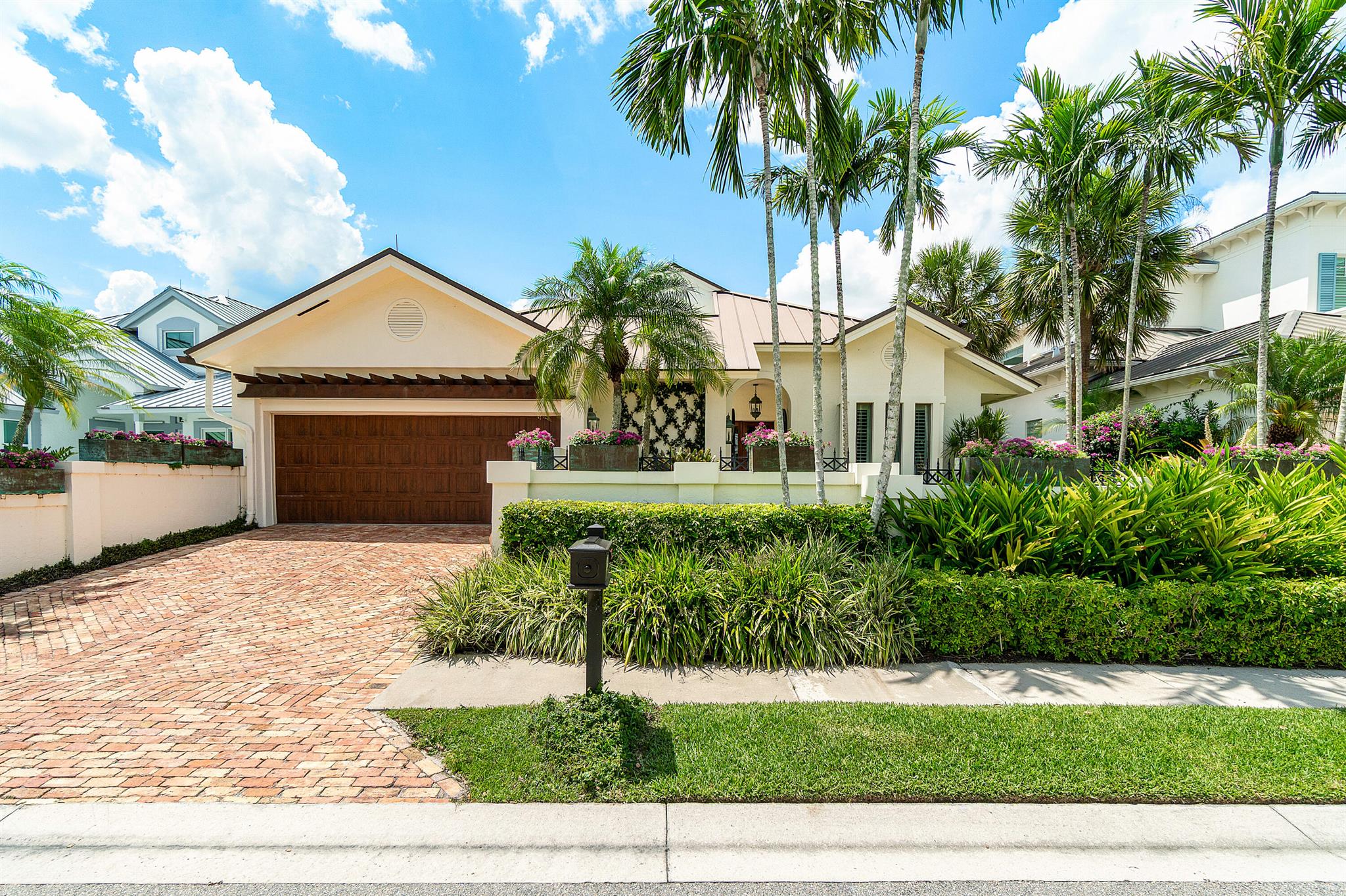 The home of an acclaimed interior designer, this impeccably curated residence blends timeless elegance with relaxed Florida sophistication. Located along the 18th fairway and just moments from the newly renovated clubhouse, this custom-built three-bedroom, three-bathroom home spans nearly 3,000 square feet of refined living space within the prestigious and highly exclusive Loxahatchee Club, recently named one of Forbes' 20 Most Exclusive Golf and Country Clubs in America in 2025.Beyond a private courtyard entry, the home opens to soaring ceilings, gallery-style walls, and a flowing open floor plan perfect for entertaining or everyday living. Many of the walls are adorned with exquisite hand-painted murals by celebrated artist Bob Christian.