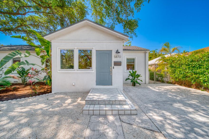 Your wait is over! This 4BR/2BA home offers total peace of mind: new roof (2023), impact glass, PVC pipes, and updated electric. Features a 2023 kitchen with premium appliances and a 2014 primary suite with office, walk-in closet, and spa bath. French doors lead to a huge deck and fenced yard with premium turf and tropical landscaping. Includes beautiful floors and electric hot water heater. Walk to David Fairchild Elementary and South Miami Park's new playground and soccer courts. It has it all!