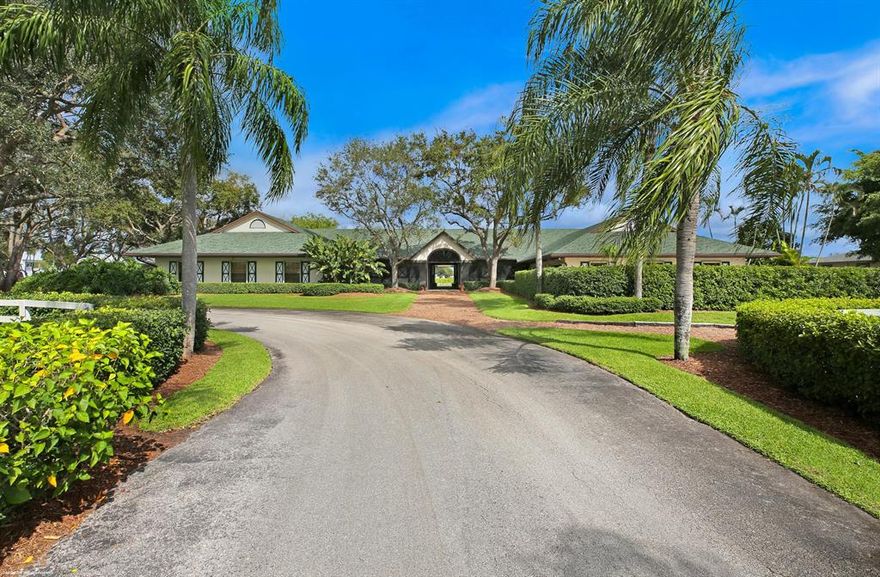 One of a kind equestrian property in a prime central Wellington location.  Situated on 9 acres, the property boasts: 28 stalls, 5 apartments (including owner's apartment with swimming pool), lots of grass turnouts, riding arena with new all-weather footing and mirrors.  There is plenty of space to build a residence, grass Grand Prix field and covered arena.  This property has great curb appeal with mature oak trees and landscaping. The farm has direct bridle path access on two sides and is hacking distance to Global or WEF.  If you're looking for a great value and a private escape from the hustle and bustle for you and your horses, this property is a must see.