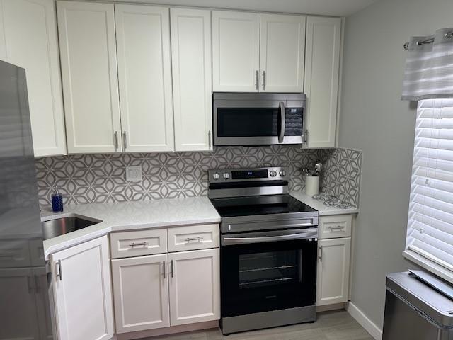 ABSOLUTELY GORGEOUS UNIT. THIS HIGHLY DESIRABLE FIRST FLOOR, TWO BEDROOM, TWO BATH CORNER CONDO IS IDEALLY LOCATED STEPS FROM THE CLUBHOUSE. BEAUTIFULLY UPDATED KITCHEN WITH STAINLESS STEEL APPLIANCES, EXTRA CABINETS, AND COUNTER SPACE. LOVELY REMODELED BATHROOMS, LAMINATE FLOORS. ENCLOSED PATIO. ASSOCIATION HAS TWO POOLS, SHUFFLEBOARD, BILLIARDS, PING PONG, LIBRARY, EXERCISE ROOM, CARD ROOM, FULL KITCHEN, AUDITORIUM, WITH SHOWS AND HOLIDAY EVENTS THROUGHOUT THE YEAR. BARBEQUE AREA. ASSOCIATION STATES 55+, 700+ CREDIT SCORE, $25000-$30000 INCOME. IF FINANCING 25% DOWN. SECURITY DEPOSIT. APPLICATION WITH IN PERSON INTERVIEW. CLOSE TO MALL, PUBLIX, WALRGREENS, RESTAURANTS, BANKS, MAJOR HIGHWAYS. SHORT DRIVE TO THE BEACH. CONSTRUCTION WILL EVENTUALLY TAKE PLACE ON THE LAND BEHIND THE UNIT.