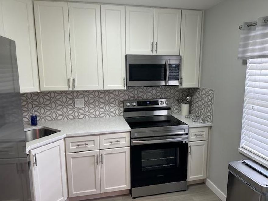 ABSOLUTELY GORGEOUS UNIT. THIS HIGHLY DESIRABLE FIRST FLOOR, TWO BEDROOM, TWO BATH CORNER CONDO IS IDEALLY LOCATED STEPS FROM THE CLUBHOUSE. BEAUTIFULLY UPDATED KITCHEN WITH STAINLESS STEEL APPLIANCES, EXTRA CABINETS, AND COUNTER SPACE. LOVELY REMODELED BATHROOMS, LAMINATE FLOORS. ENCLOSED PATIO. ASSOCIATION HAS TWO POOLS, SHUFFLEBOARD, BILLIARDS, PING PONG, LIBRARY, EXERCISE ROOM, CARD ROOM, FULL KITCHEN, AUDITORIUM, WITH SHOWS AND HOLIDAY EVENTS THROUGHOUT THE YEAR. BARBEQUE AREA. ASSOCIATION STATES 55+, 700+ CREDIT SCORE, $25000-$30000 INCOME. IF FINANCING 25% DOWN. SECURITY DEPOSIT. APPLICATION WITH IN PERSON INTERVIEW. CLOSE TO MALL, PUBLIX, WALRGREENS, RESTAURANTS, BANKS, MAJOR HIGHWAYS. SHORT DRIVE TO THE BEACH. CONSTRUCTION WILL EVENTUALLY TAKE PLACE ON THE LAND BEHIND THE UNIT.