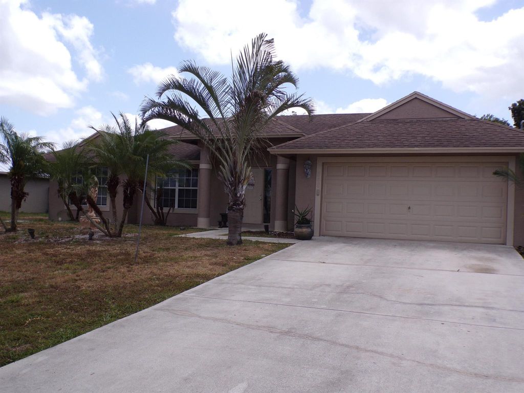 Photo of 848 SW Squirrel Avenue Ave, Port St Lucie, FL 34953 (MLS # R10794143)