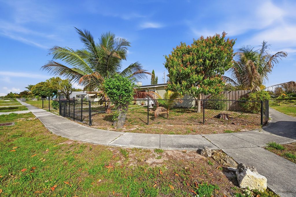 Photo of 721 Dogwood Road, West Palm Beach, FL 33409 (MLS # B26000027)