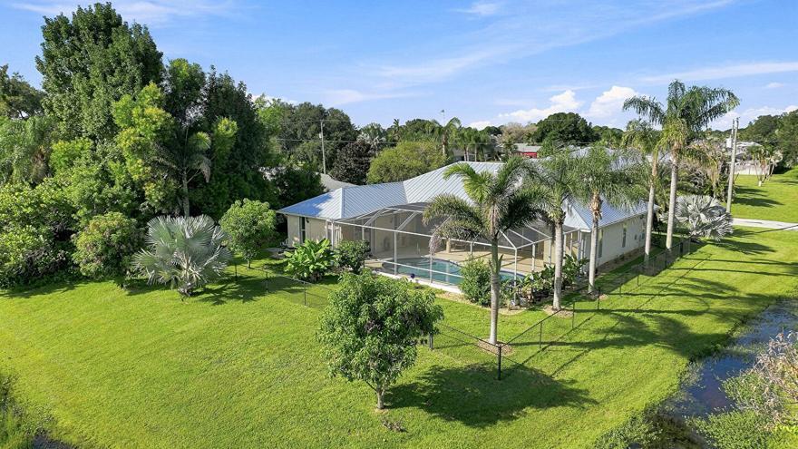 Photo of 1863 SE Bowie Street, Port Saint Lucie, FL 34952 (MLS # B26071695)