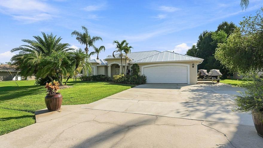 Photo of 1863 SE Bowie Street, Port Saint Lucie, FL 34952 (MLS # B26071695)