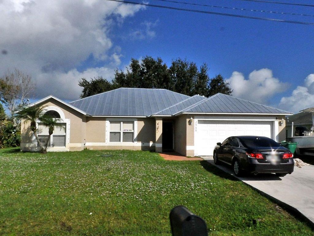 Photo of 2968 SE Buccaneer Circle, Port Saint Lucie, FL 34952 (MLS # R11007707)