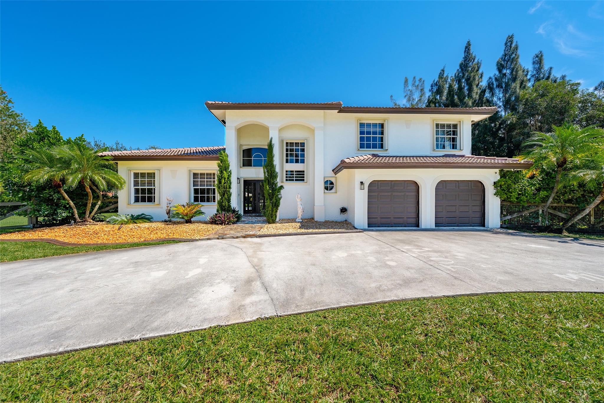 Looking for your dream home w/ plenty of room on a builder’s acre in Southwest Ranches? This updated estate style 2story corner lot home in the Trails is it! The home features marble & wood flooring, a newer eat-in kitchen w/ rich dark wood cabinets, granite counters & stainless appliances. The home boasts ample space and comfort for your family from the spacious living room, formal dining room and large family room to the fantastic backyard for entertaining with resort-like pool with spa and travertine marble floor. Enjoy a margarita under the custom pergola and the outdoor kitchen is perfect for those BBQ days. The roof is 2022 and under warranty. Room for your boat & RV. Equestrian community. Home has City Water & Sewer. Don't miss out on this chance to own a piece of paradise.
